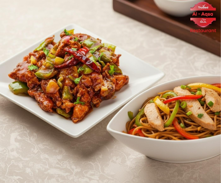 Hakka noodles and gravy chicken chili — authentic Chinese catering dishes.